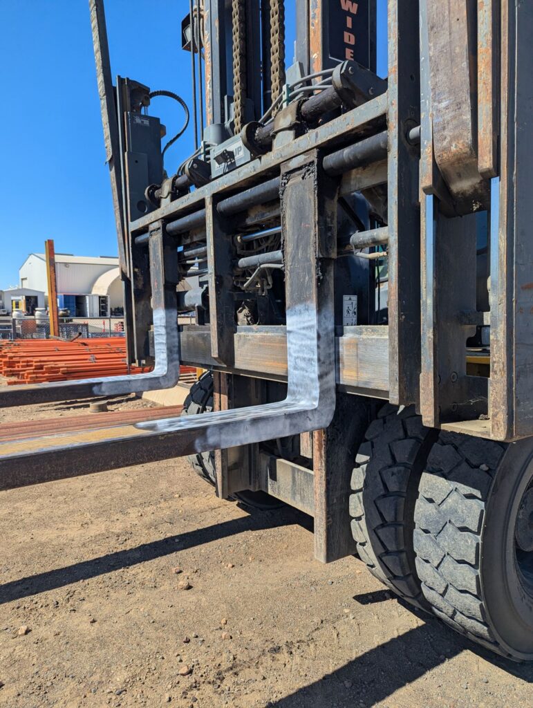 Forklift tines prepared for magnetic particle inspection