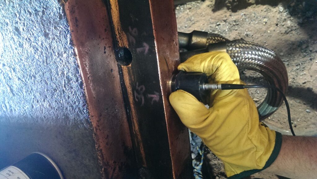 Technician scanning a weld with an ultrasonic probe